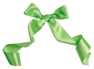 Wall Mural - Green ribbon curl isolated on white background. Bright green ribbon bow and curl isolated on white background. Textile accessories for sewing and gift scrapbooking decorations. Atlas or silk ribbon