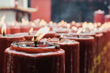 Close-up Of Burning Candles In Church