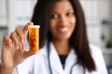 Wall Mural - Female black doctor hands hold jar of pills closeup. Panacea life save healthy lifestyle prescribe treatment legal drug store contraception concept