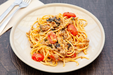 Wall Mural - Spaghetti bolognese with tomato, cheese and basil on a plate