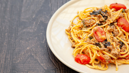 Wall Mural - Spaghetti bolognese with tomato, cheese and basil on a plate