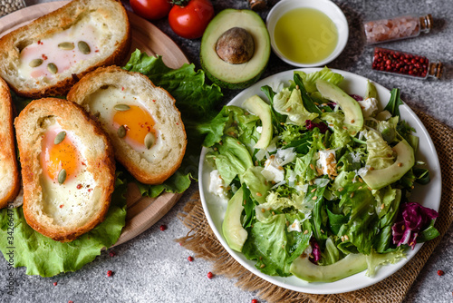 Delicious breakfast with grunts, eggs, avocado and cherry tomatoes Poster Mural XXL