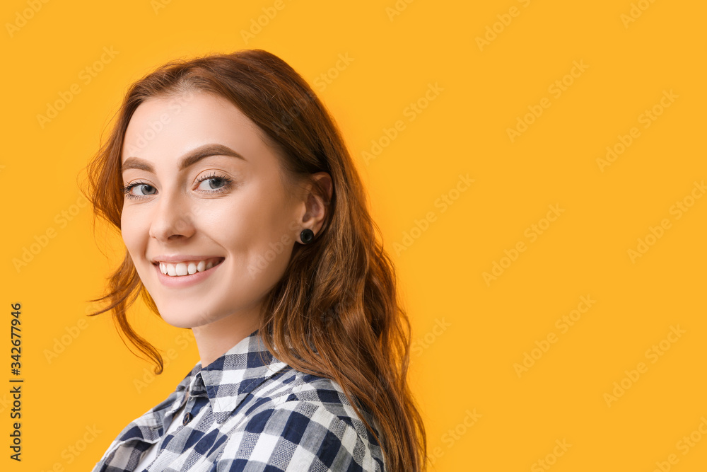 Young woman with healthy teeth on color background