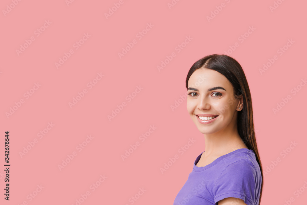 Young woman with healthy teeth on color background