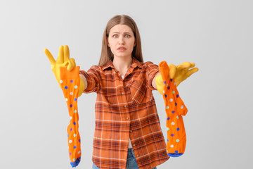 Canvas Print - Troubled woman with dirty socks on grey background