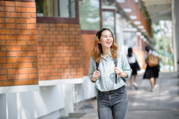 Wall Mural - Happy young Asian University student.