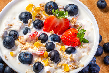 Wall Mural - Yogurt with granola, strawberries and blueberries.