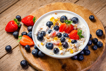 Wall Mural - Yogurt with granola, strawberries and blueberries.