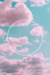 Wall Mural - Aesthetic art collage with beautiful turquoise sky with pink clouds and circle light frame. Minimal