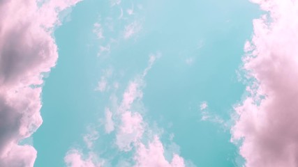 Wall Mural - Motions clouds. Puffy fluffy beautiful pink clouds on turquise sky time lapse. Slow moving clouds. Pastel palette. Empty space for text