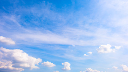 Wall Mural - Beautiful blue summer sky with fluffy clouds as a background