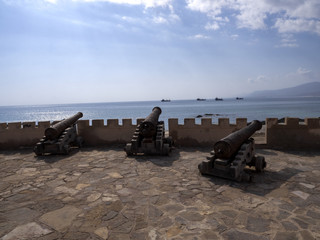 Historic cannons on the coast at Mirbat Bay. Oman.