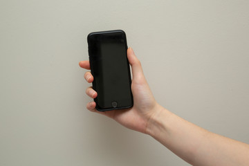 Female hand with mobile phone 
