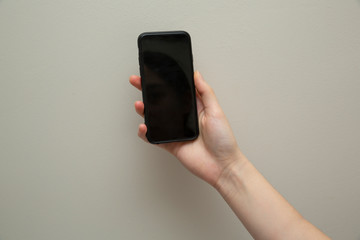 Female hand with mobile phone 
