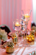 Wedding decoration with large glass of wine as a candle holder