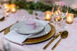 Red Pink wedding table service with whit and gold plates and furniture 