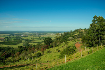 Wall Mural - Green valley with hills and meadow