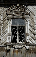 Wall Mural - Window in an old wooden building in Chelyabinsk, Russia.