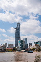 Saigon skyline and the Saigon River with Bitexco tower. Ho Chi Minh City is a popular tourist destination of Vietnam.