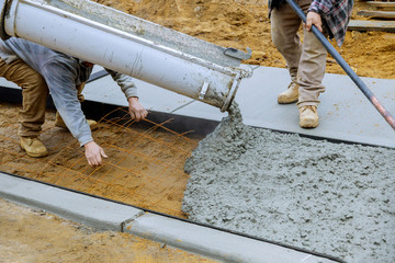 Canvas Print - Pouring concrete to create in the walking sidewalk