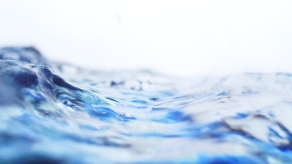 Wall Mural - Soft blur focus of Abstract water splash surface filling the frame with the water drop and waving liquid with an air bubble on a white background and copy space.