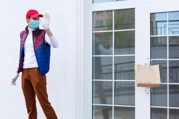 Sticker - Grocery delivery man wearing medical gloves and face mask. Online shopping and delivery for grocerys, wine and food. Self Quarantine during coronavirus pandemic. Food delivery service courier