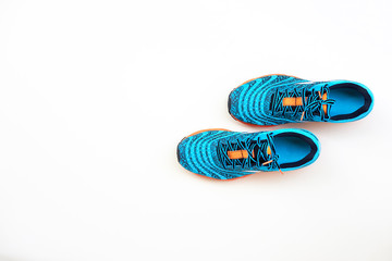 Wall Mural - blue running shoes for men on a white background