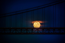 Silhouette Suspension Bridge Against Moon At Night