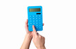 © splitov27 - Hand holds blue calculator Isolated on a white background.