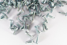 High Angle View Of Screws On White Background