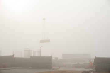 Wall Mural - Construction site on a foggy autumn day