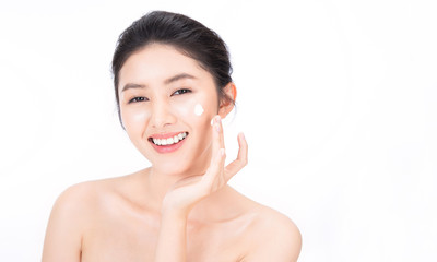 Closeup portrait of beauty asian woman with fair perfect clear healthy glow skin hand apply lotion, young beautiful asia girl with pretty smile on face. Beauty korean clinic facial skincare banner