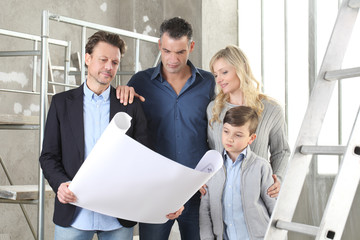 Wall Mural - Architect showing house design plans to a family with child. Meeting at interior construction site to talk about house appearance, interior decoration and home layout