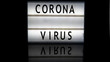 Corona virus letters on a light box on reflective surface