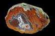 © wojtekmt - Amoeba agate filled with quartz. Colorful ribbons colored with metal oxides are visible. Origin: Rudno near Krakow, Poland.