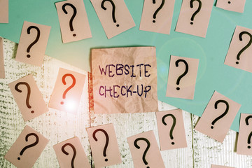 Fototapete - Handwriting text Website Check Up. Conceptual photo an examination of a website to see if something is in order Scribbled and crumbling papers with thick cardboard above wooden table