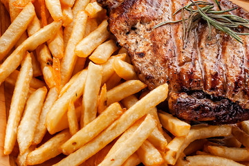 fried pork steak with french fries closeup