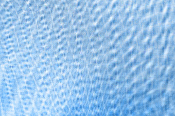 abstraction background: unique wavy pattern of overlaying two grids, blurry and tinted to classic blue