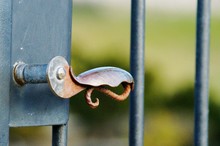Close-up Of Rusty Handle Of Gate