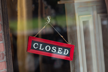 Wall Mural - sorry we are closed sign hanging outside a restaurant, store, office or other