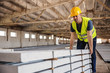 © Dusan Petkovic - Blue collar worker doing his job at construction site.