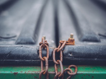 Rusty Chain Anchored On Equipment
