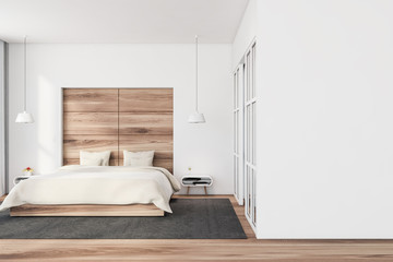 White and wood bedroom with mock up wall