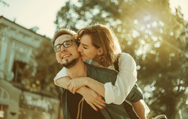 Romantic youth concept. Young stylish hipster couple in love at the city.