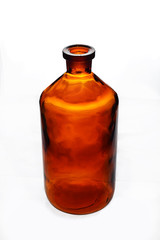 Old retro big bottle brown curved glass isolated on a white background 