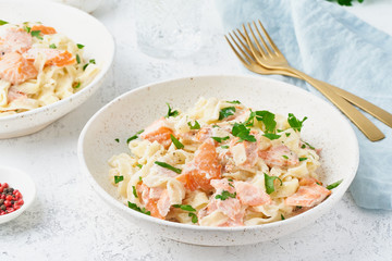 Canvas Print - Salmon pasta, tagliatelle with fish and creamy sauce. Italian dinner with seafood