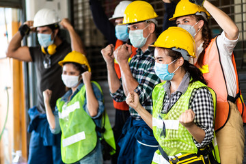 Wall Mural - industry engineer team Asian wearing uniform and hard hats happy and celebrating success at Metal lathe industrial manufacturing factory. Engineer Operating  lathe Machinery