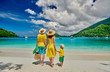 © haveseen - Family with three year old boy on beach. Seychelles, Mahe, Port Launay.