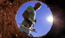 Gardener Digging With Garden Spade In Black Earth Soil. Farming, Gardening, Agriculture And People Concept. Under View Man With Shovel Digging.