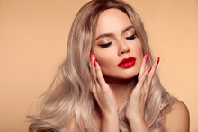 Makeup, Manicured Nails. Beauty Portrait Of Blonde Woman With Red Lips, Long Healthy Shiny Blond Hair Style. Sensual Girl With Bright Makeup Isolated On Beige Backhround.